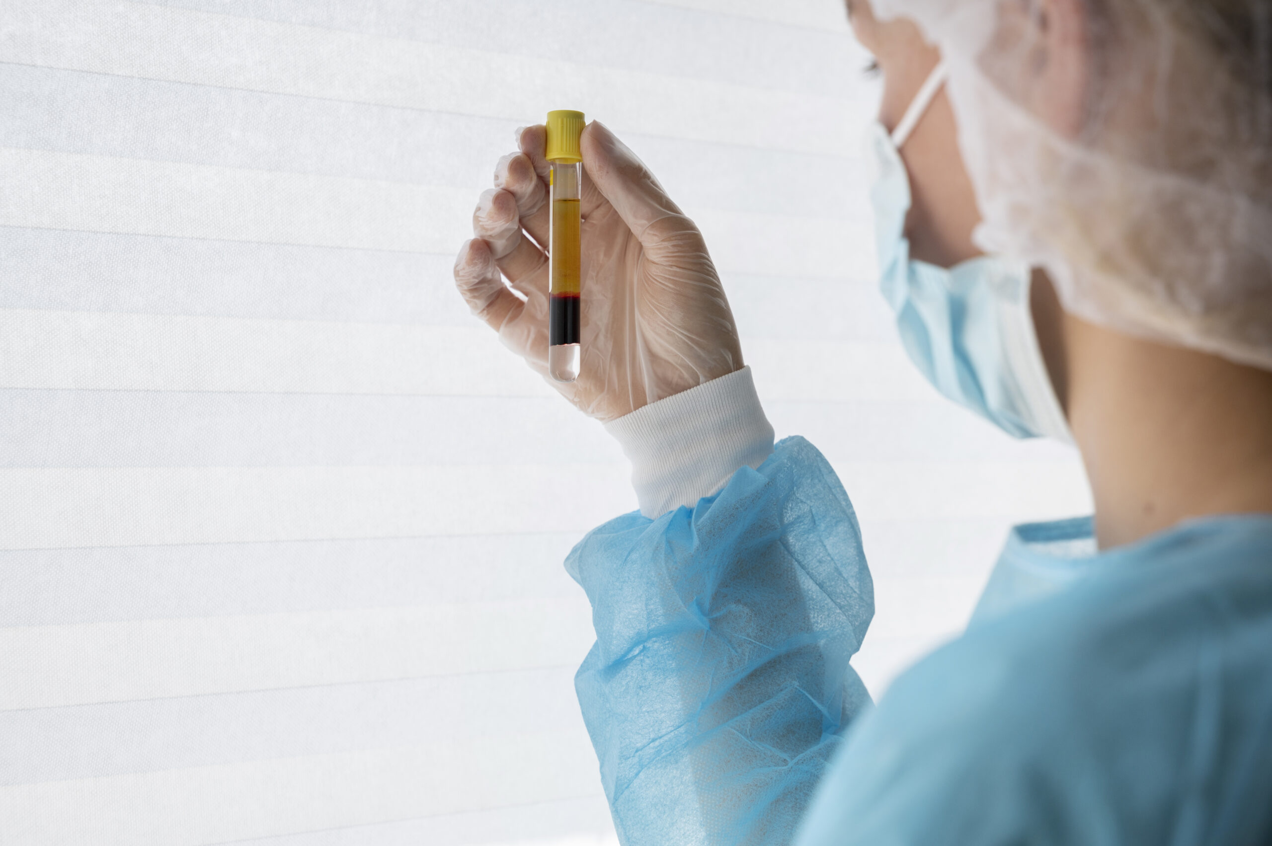 side-view-doctor-holding-vial